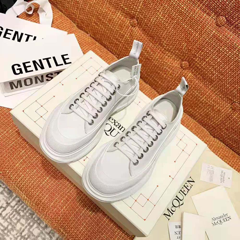 Close-up of white leather and chunky sole on Alexander Mcqueen Women Tread Slick Lace Up-White