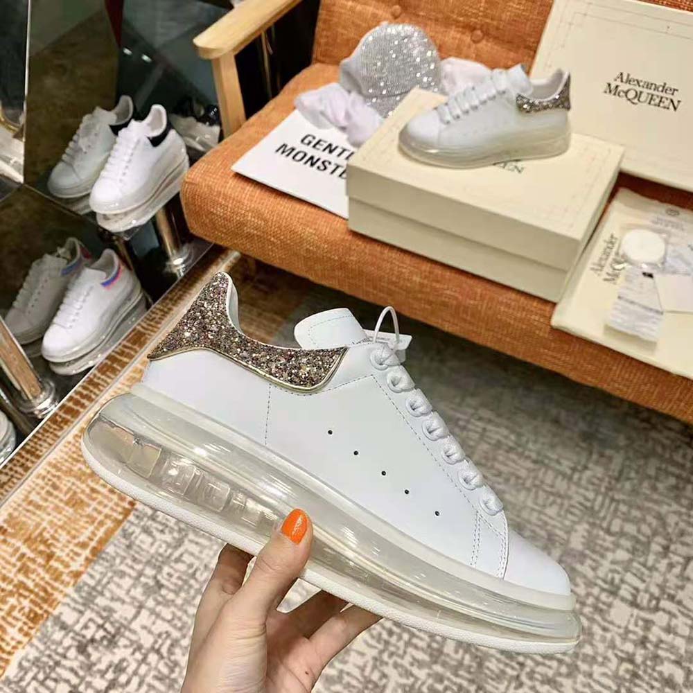 Top-down view showing laces on Alexander Mcqueen white leather sneaker