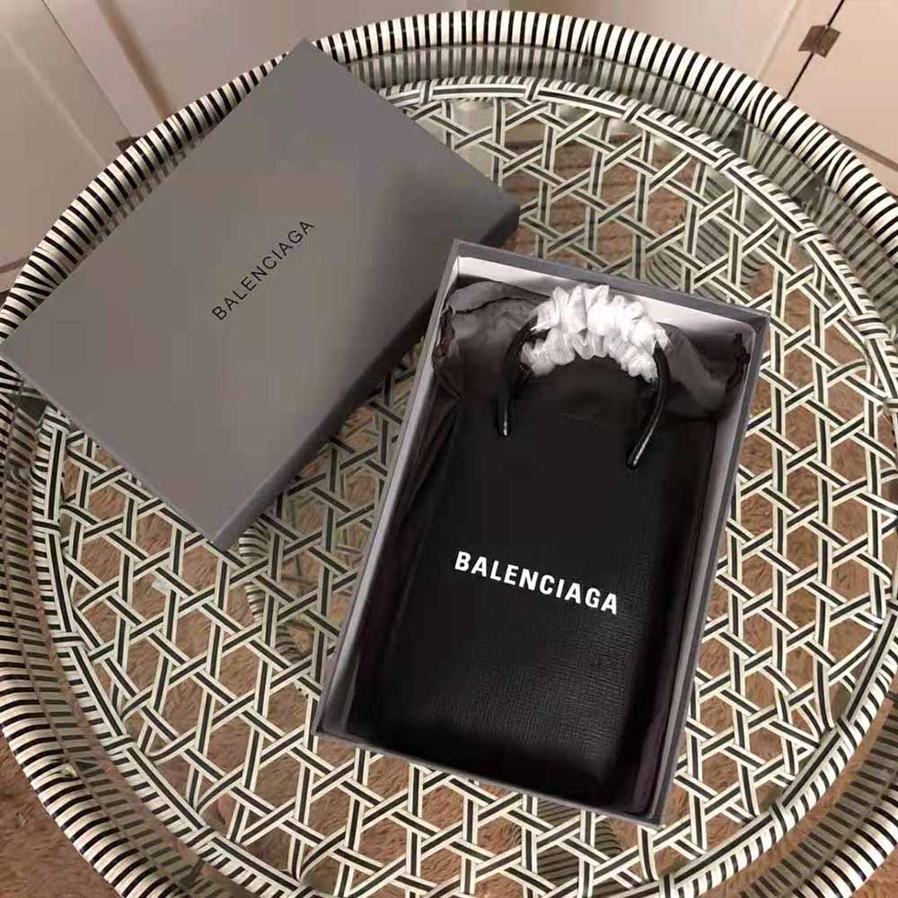 Close-up of silver-tone hardware and zip on Balenciaga phone holder