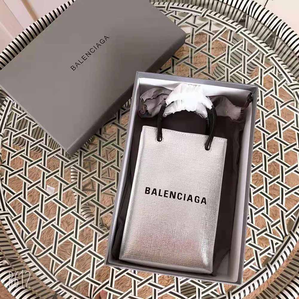 Close-up of silver metallized squared calfskin texture and hardware detail