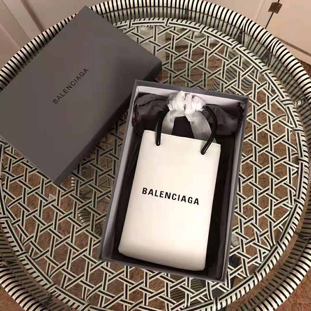 Close-up of silver hardware and smooth calfskin texture on Balenciaga phone holder