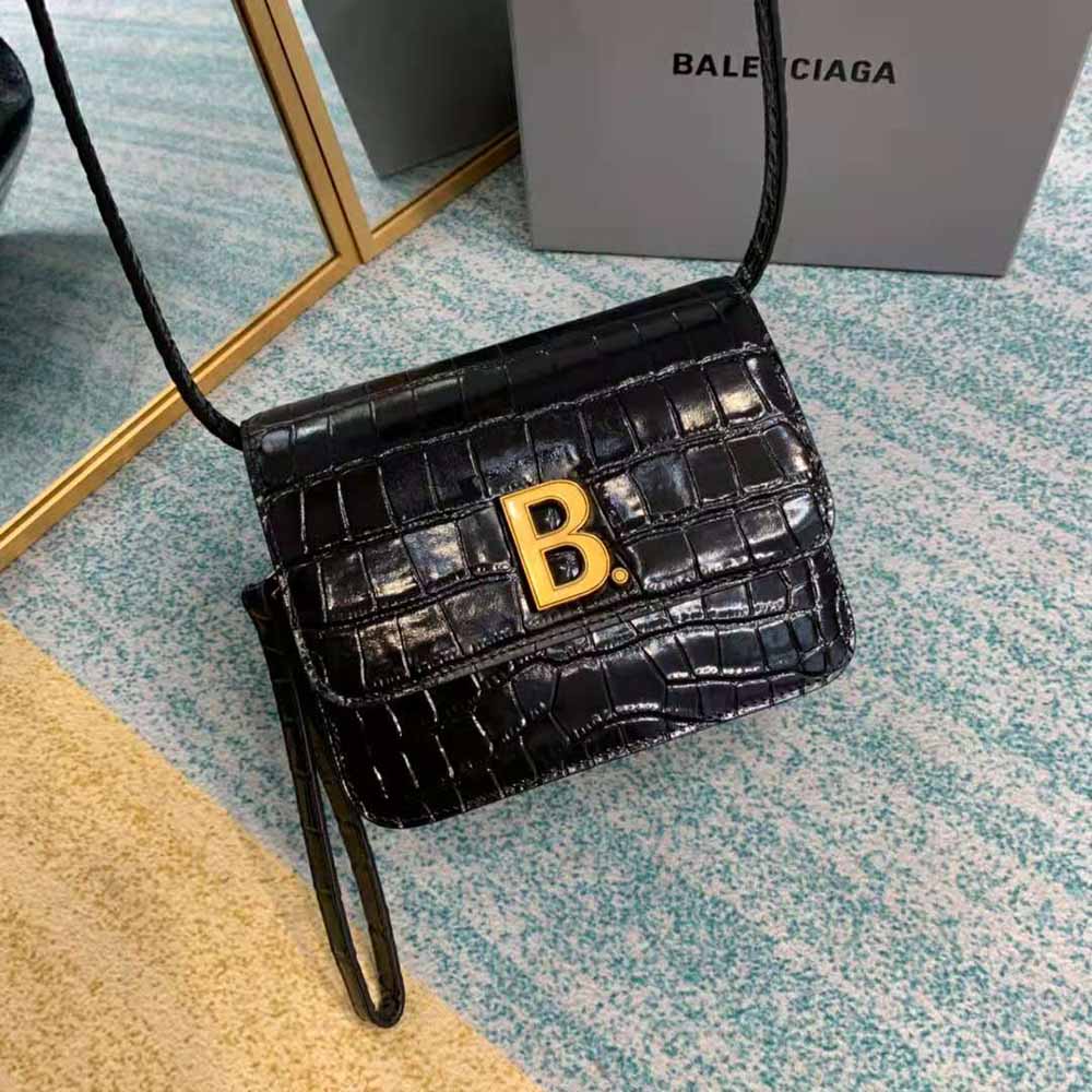 Side angle showing compact silhouette of Balenciaga Women B. Small Bag black