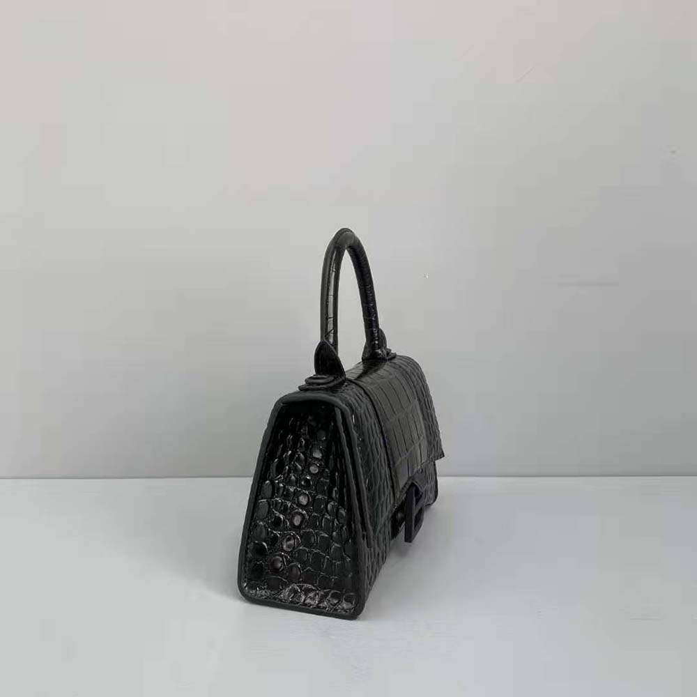 Side profile showing curved silhouette of Balenciaga Hourglass XS bag