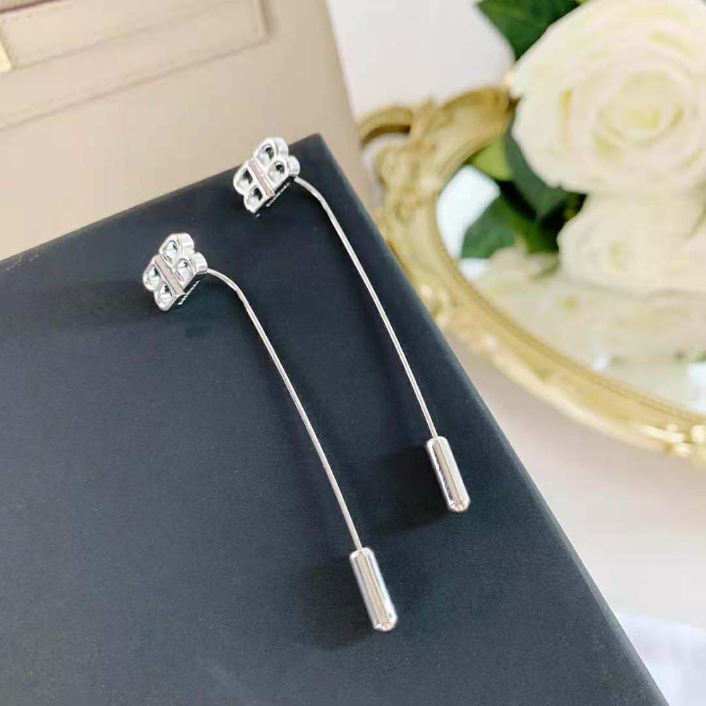 Detail of Balenciaga Women Pin BB Earrings showcasing BB logo hardware