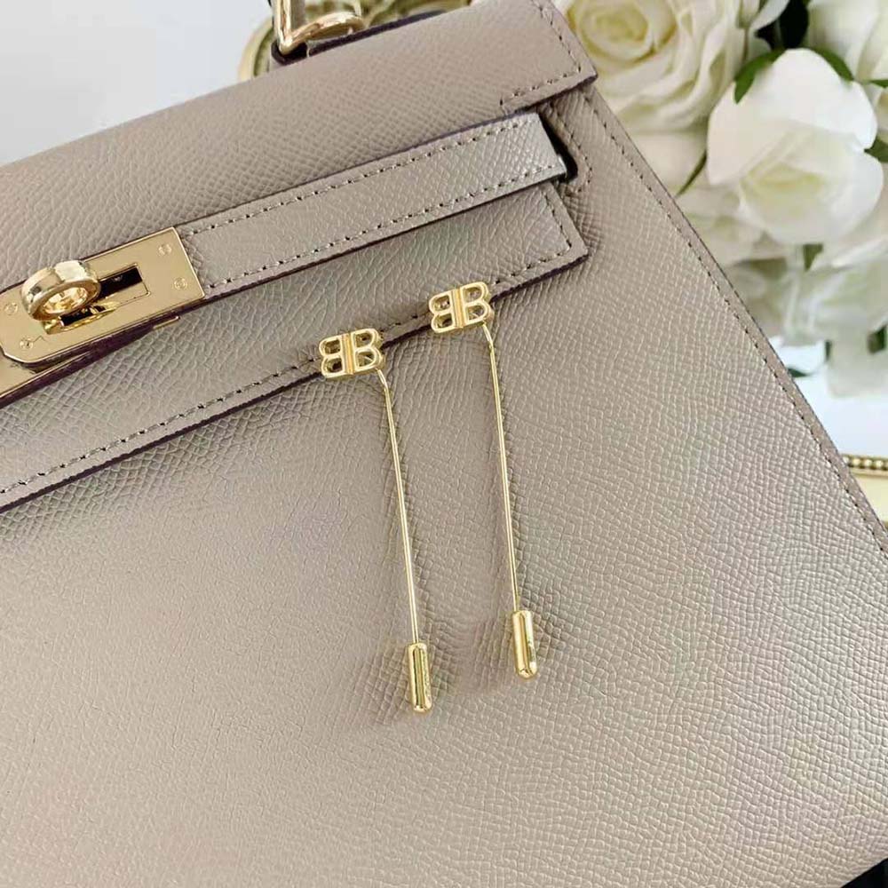 Side profile showing push-back closure of Balenciaga Women Pin BB Earrings