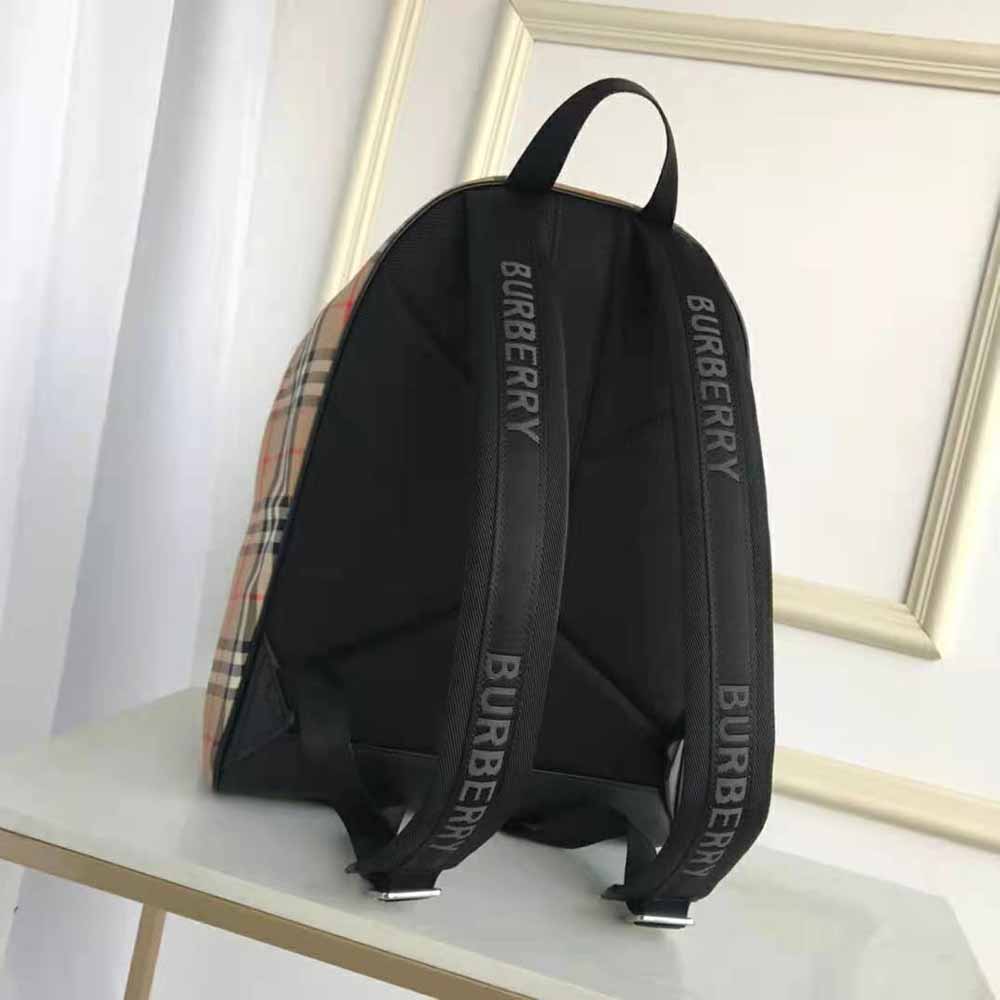 Side angle highlighting adjustable straps on Burberry Men Vintage Check Nylon Backpack-Brown