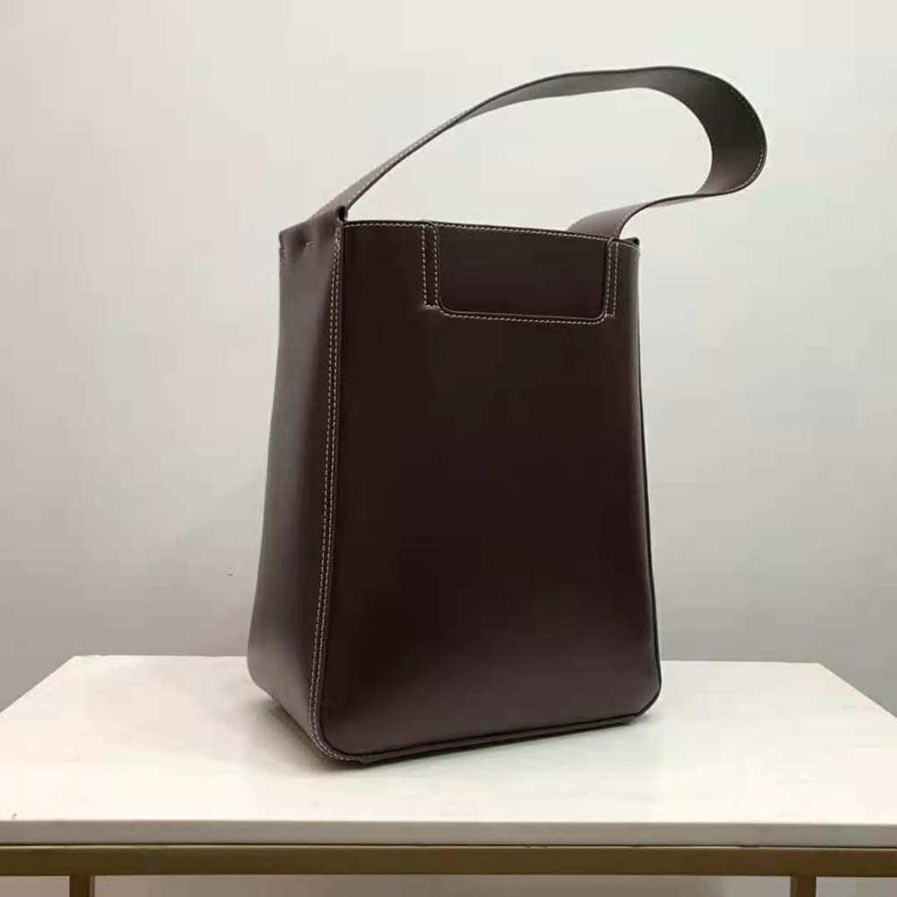 Side profile of Burberry Women Large Leather Basket Bag-Maroon with drawstring detail