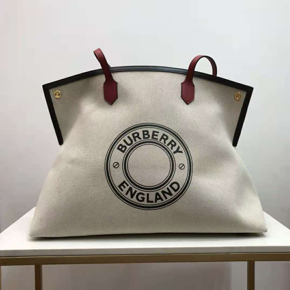 Close-up of Burberry logo graphic on white cotton canvas tote