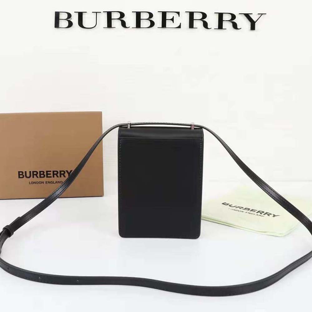 Side profile showing adjustable strap on Burberry Women Leather Robin Bag-Black