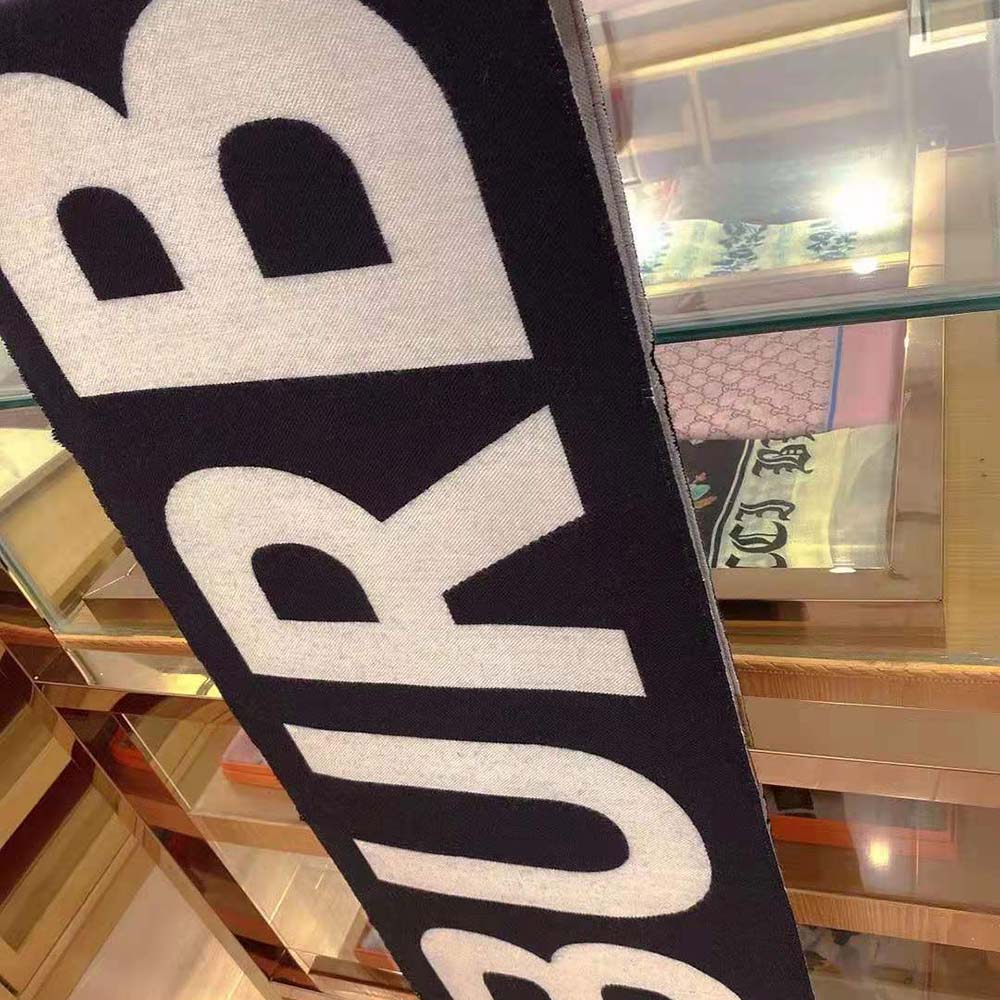 Side angle showing texture of Burberry Women Logo Wool Jacquard Scarf-Black