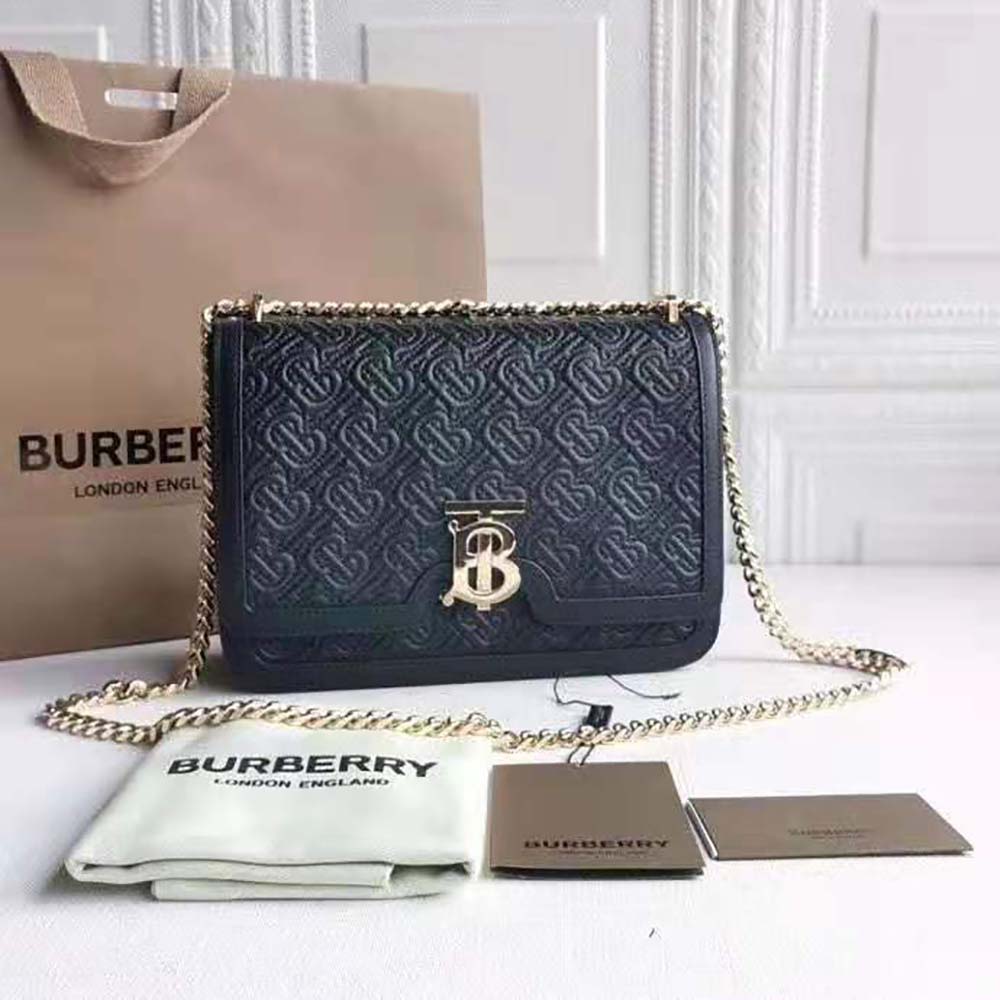 Close-up of gold TB monogram hardware on Burberry lambskin bag
