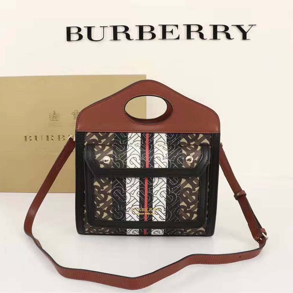 Close-up of Burberry monogram and gold-tone hardware detail on the pocket bag