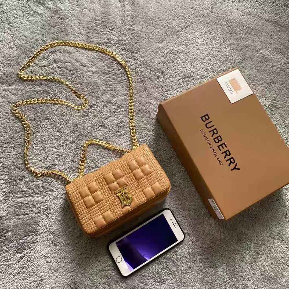Close-up of antique gold-tone hardware on Burberry Women Mini Quilted Lambskin Lola Bag-Sandy