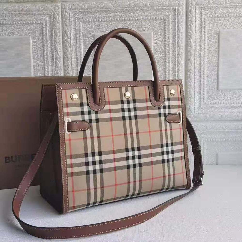 Close-up of leather handles and gold hardware on Burberry Women Mini Vintage Check Two-handle Title Bag-Brown