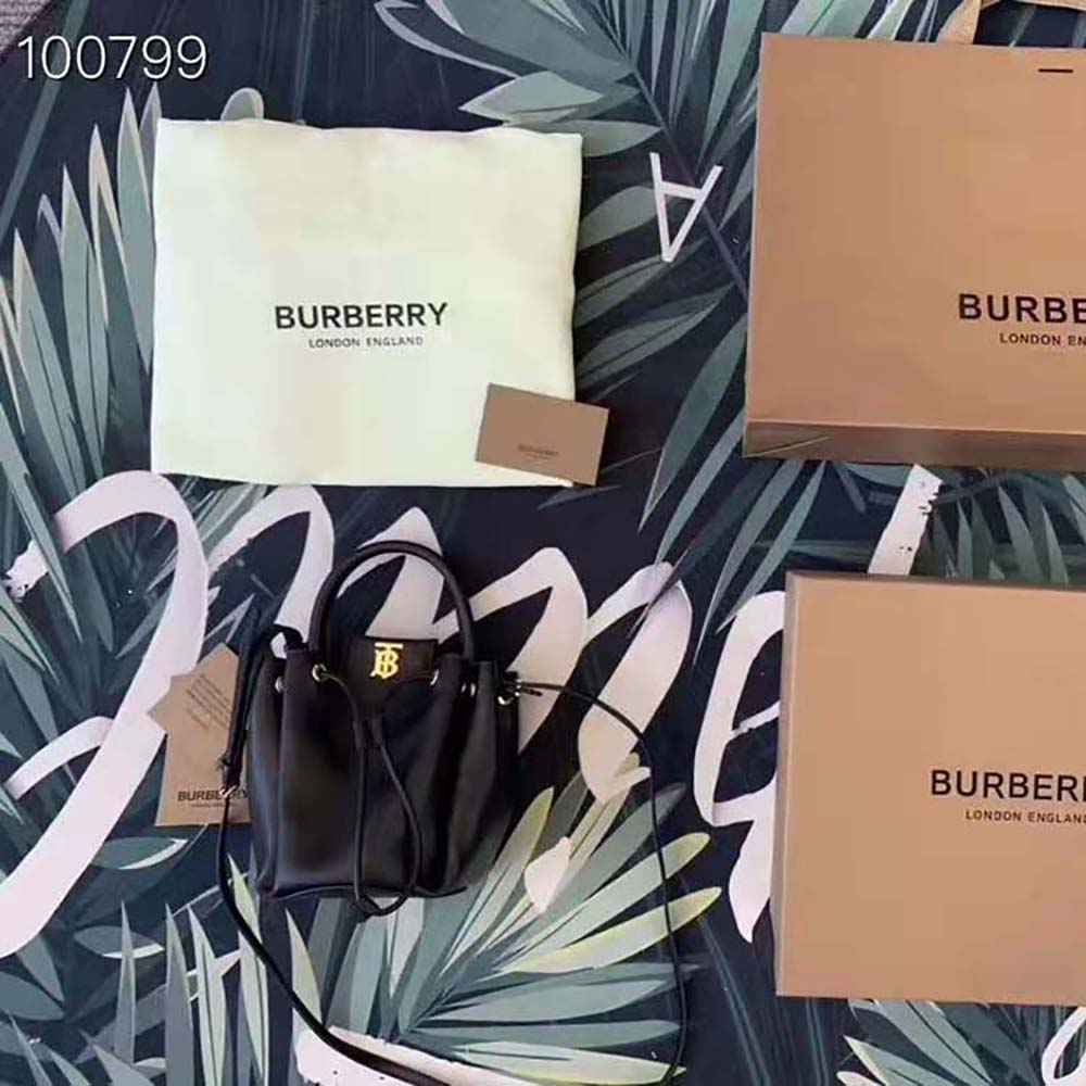 Close-up of Burberry monogram hardware on leather bucket bag
