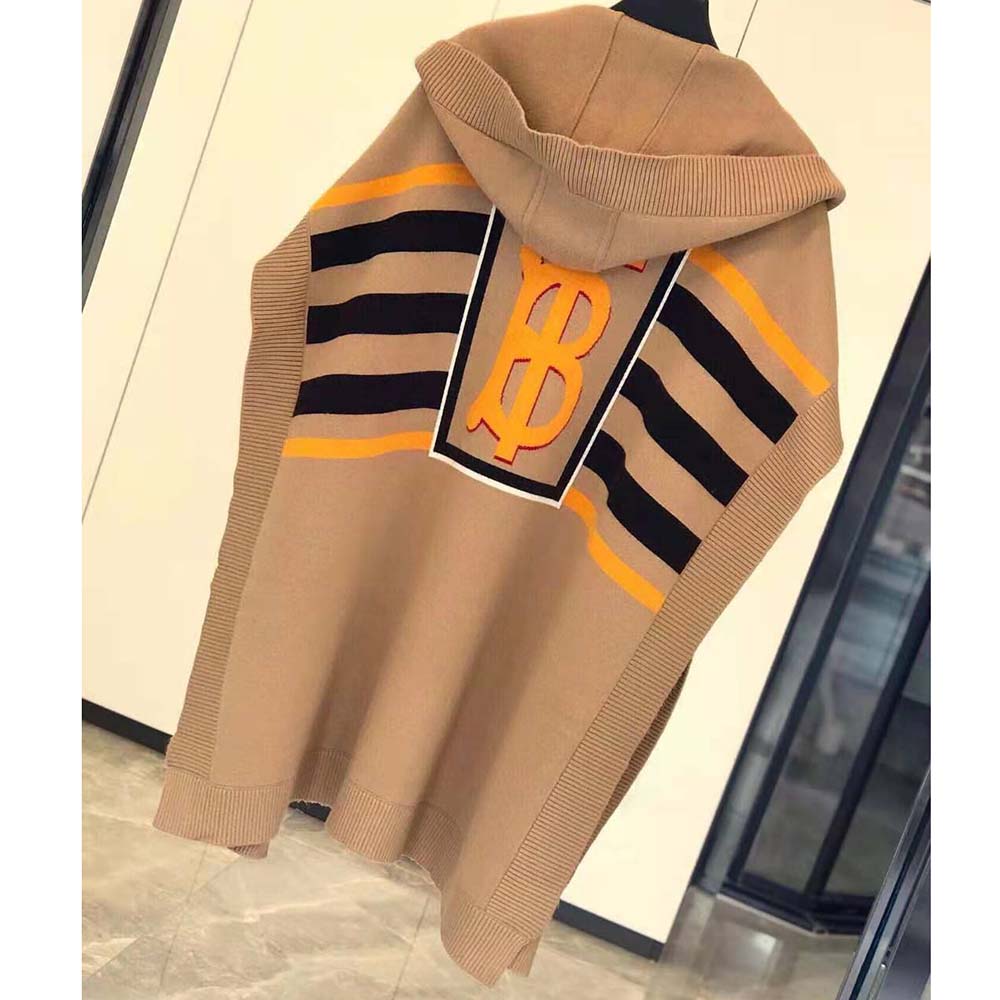 Side angle showing relaxed silhouette of Burberry Women Monogram Motif Lntarsia Cape