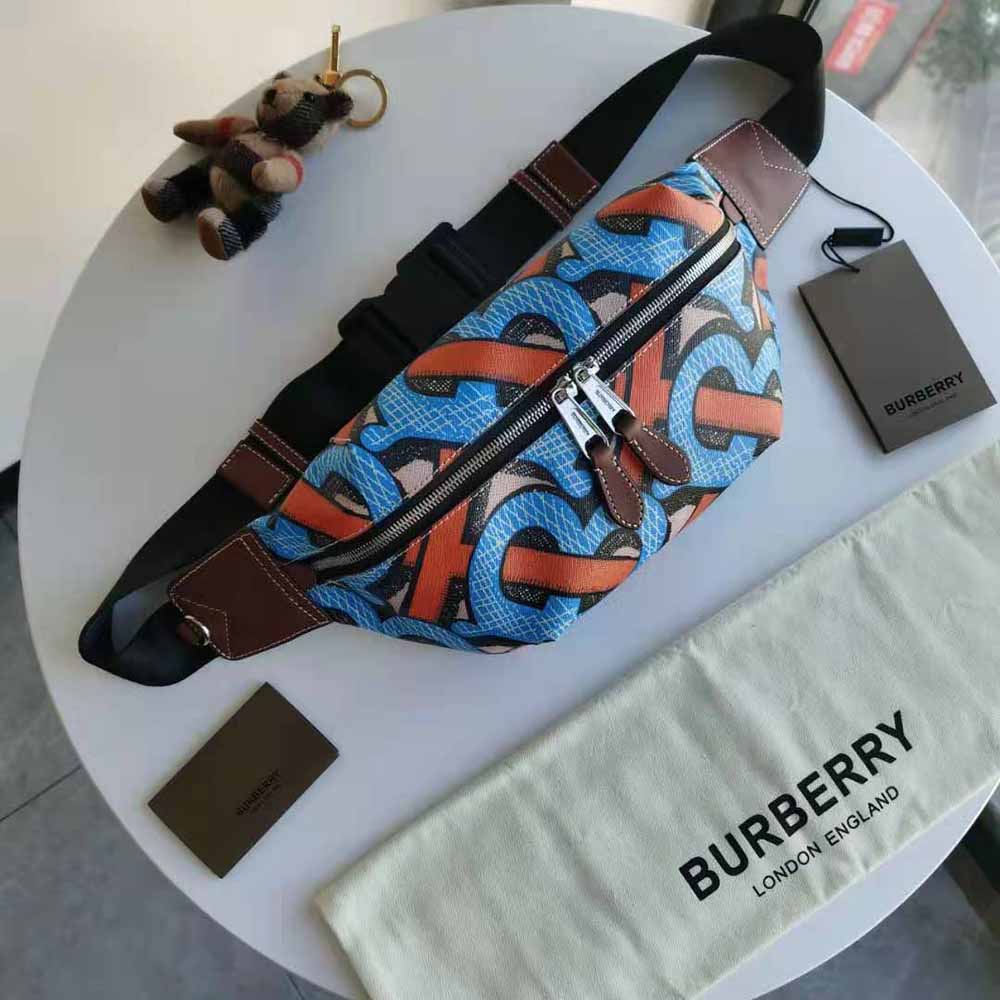Close-up of orange monogram print and zip detail on Burberry bum bag