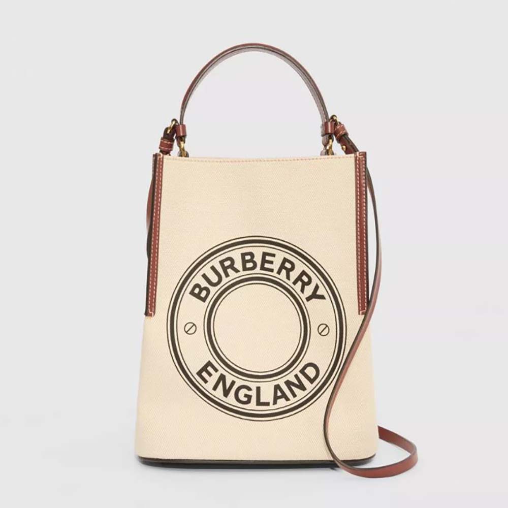 Front view of Burberry Women Small Logo Graphic Cotton Canvas Peggy Bucket Bag in white