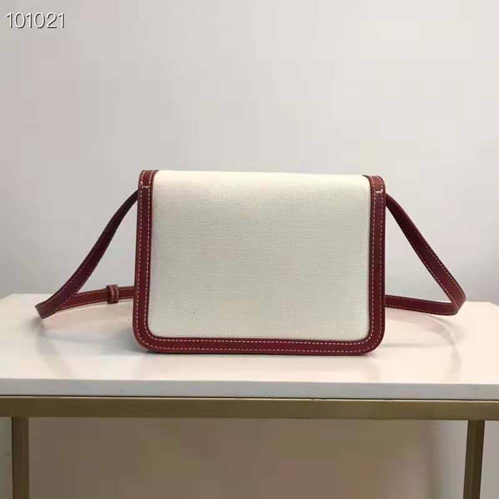 Side profile showing red leather and canvas texture on Burberry TB Bag