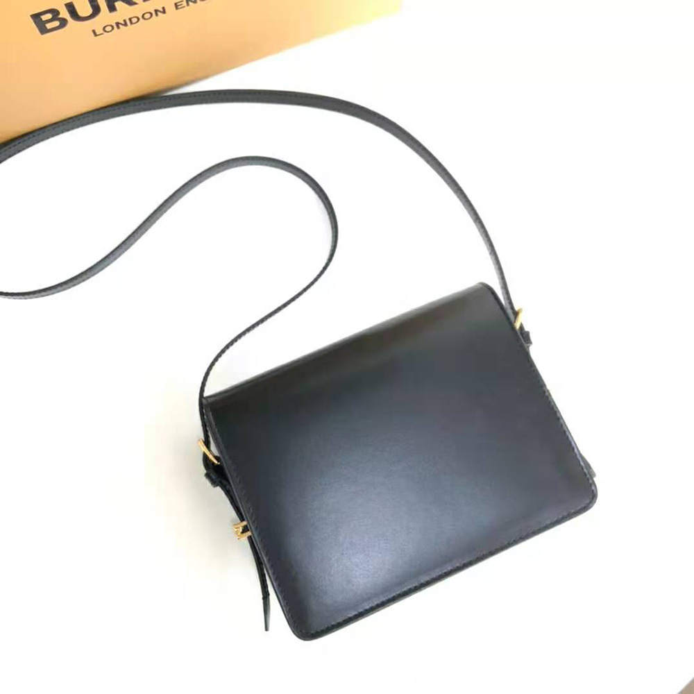 Side angle showing structured silhouette of Burberry Women Small Two-tone Leather Grace Bag-Black