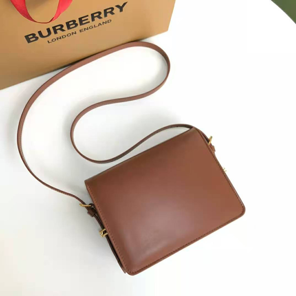 Side profile of Burberry Women Small Two-tone Leather Grace Bag-Brown shoulder strap visible