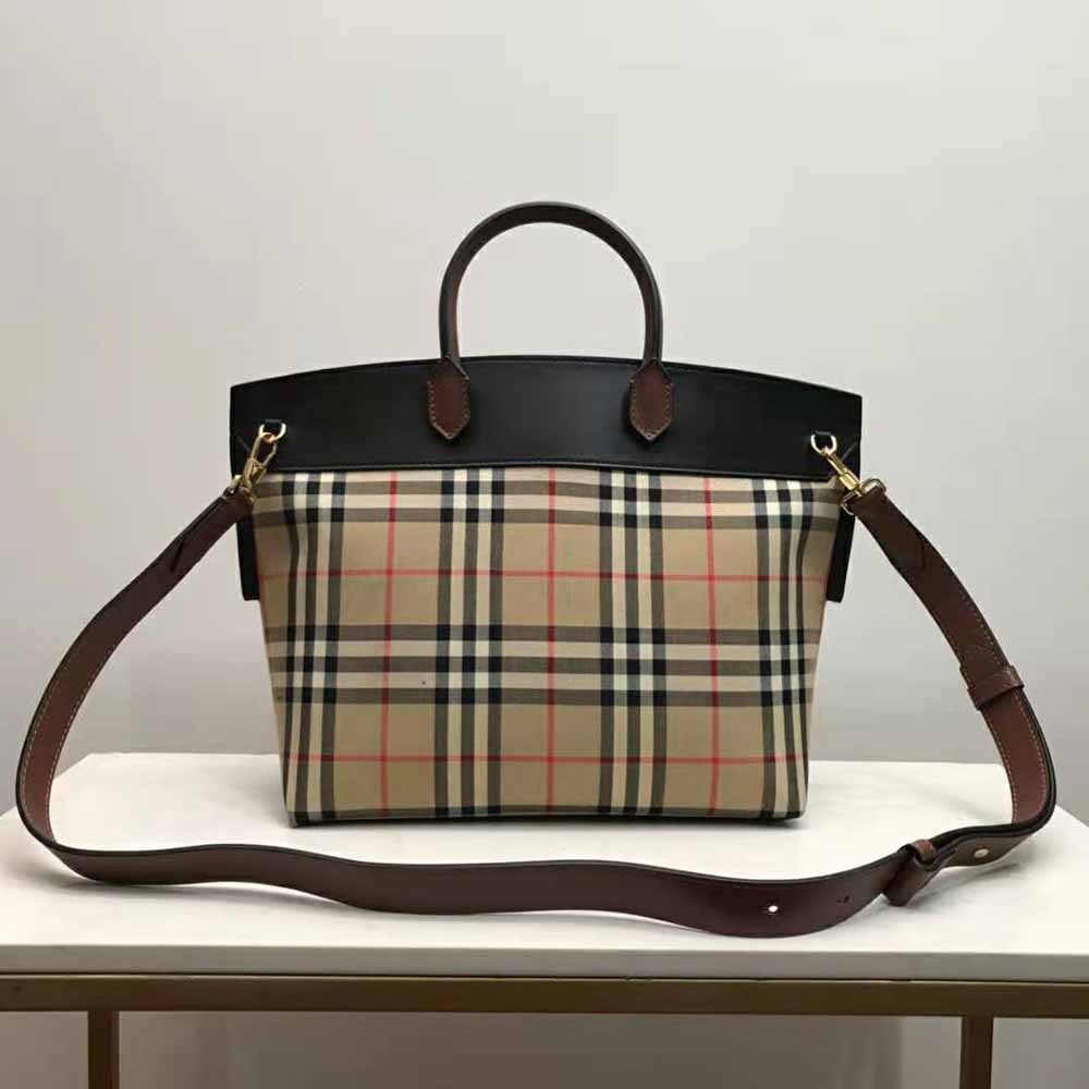 Side angle showing compact silhouette of Burberry Vintage Check Society bag