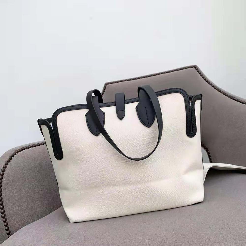 Side profile showing adjustable strap on Burberry Women The Medium Soft Cotton Canvas Belt Bag-White