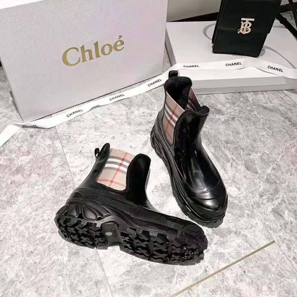 Top angle showcasing coated canvas texture on Burberry Women Vintage Check Chelsea Boots