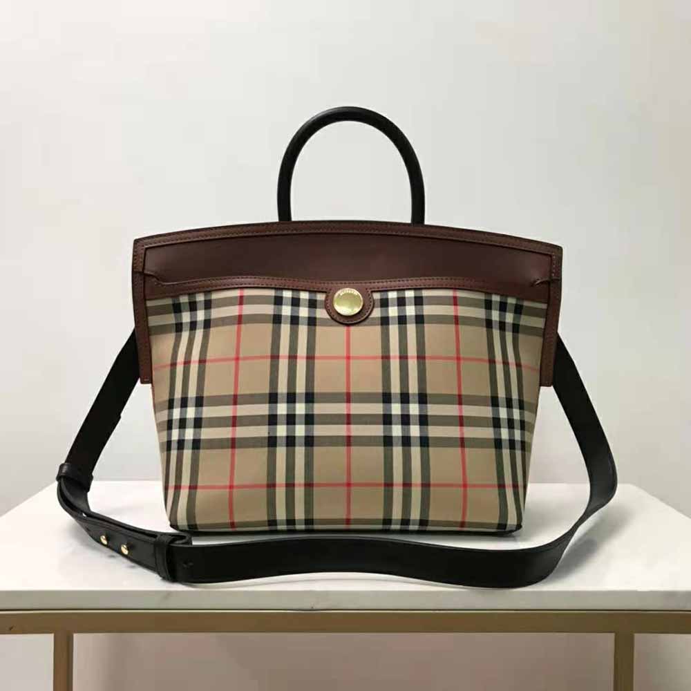 Close-up showing gold hardware and vintage check detail on Burberry Society bag