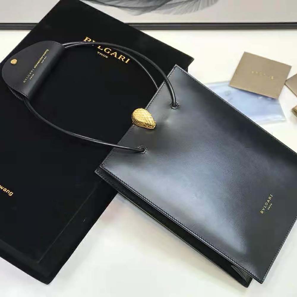Close-up of signature Bvlgari hardware on black calf leather tote