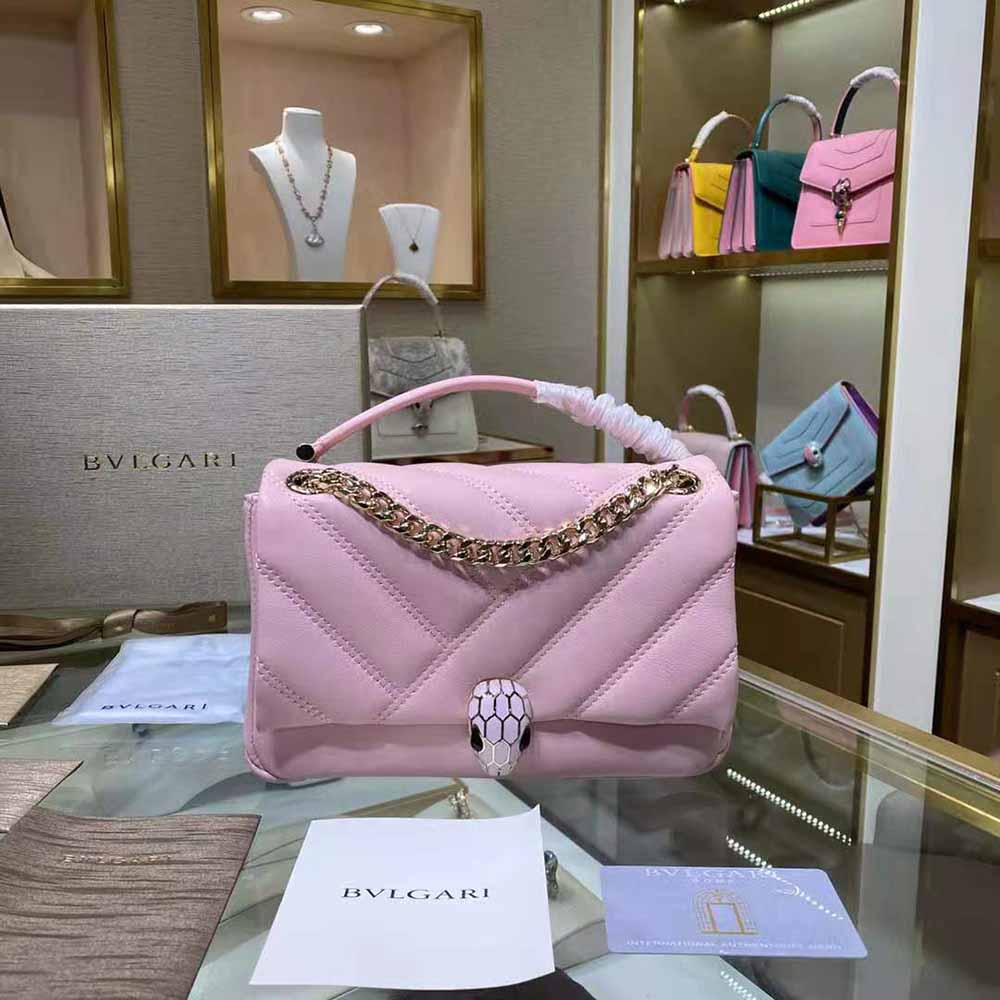 Close-up of the gold-tone Serpenti cabochon detail on Bvlgari Shoulder Bag Pink