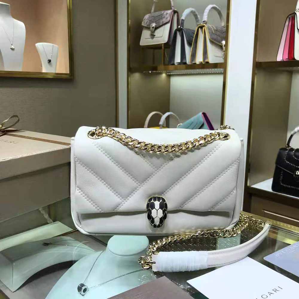Close-up detail of gold serpent head closure on Bvlgari Women Serpenti Cabochon Shoulder Bag-White