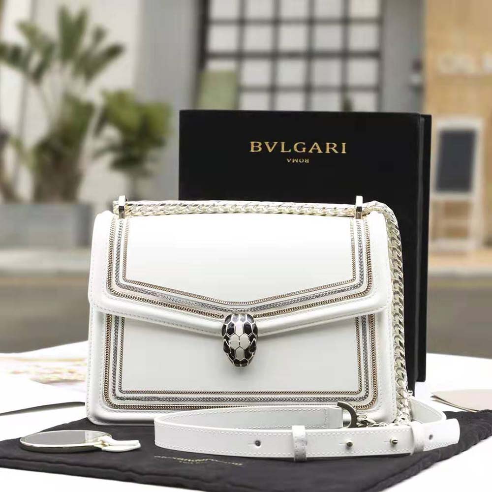 Close-up of signature serpent head closure on Bvlgari Women Serpenti Diamond Blast Shoulder Bag-White