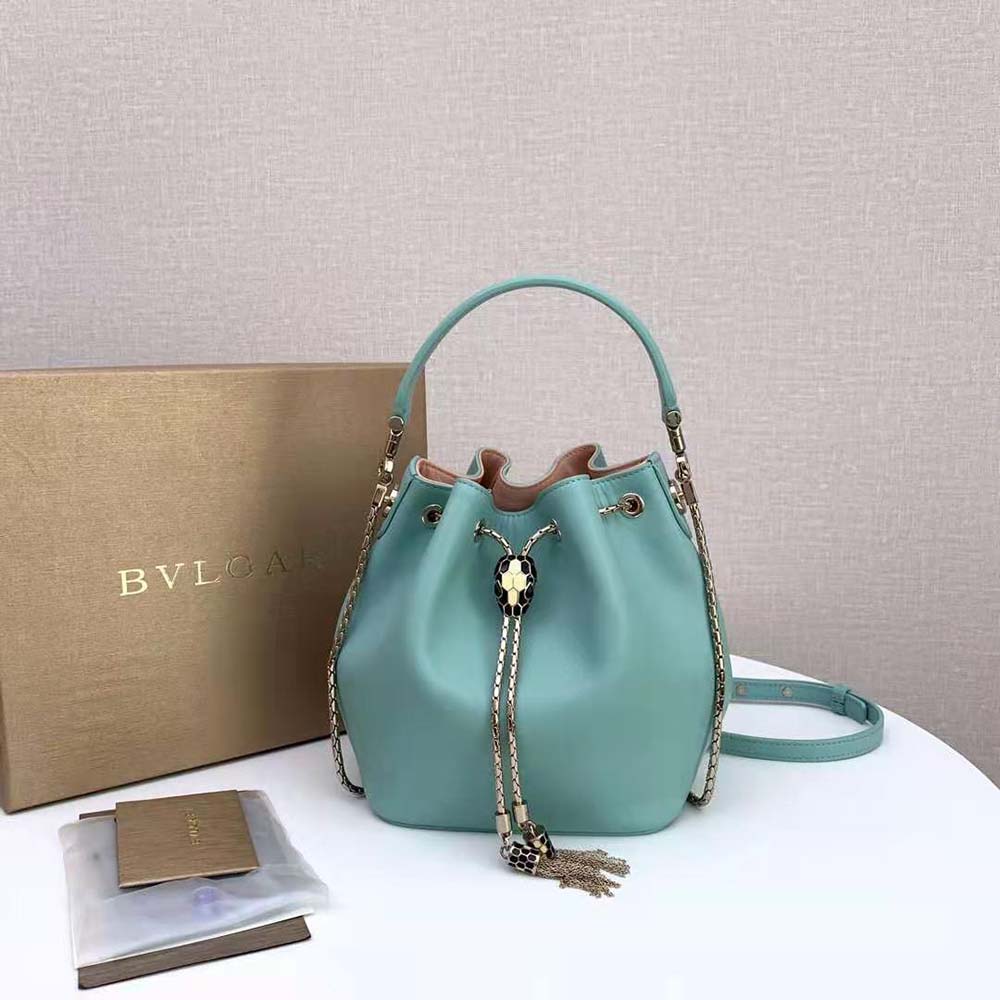 Close-up of gold-tone snakehead closure on Bvlgari Women Serpenti Forever Bucket Bag-Aqua