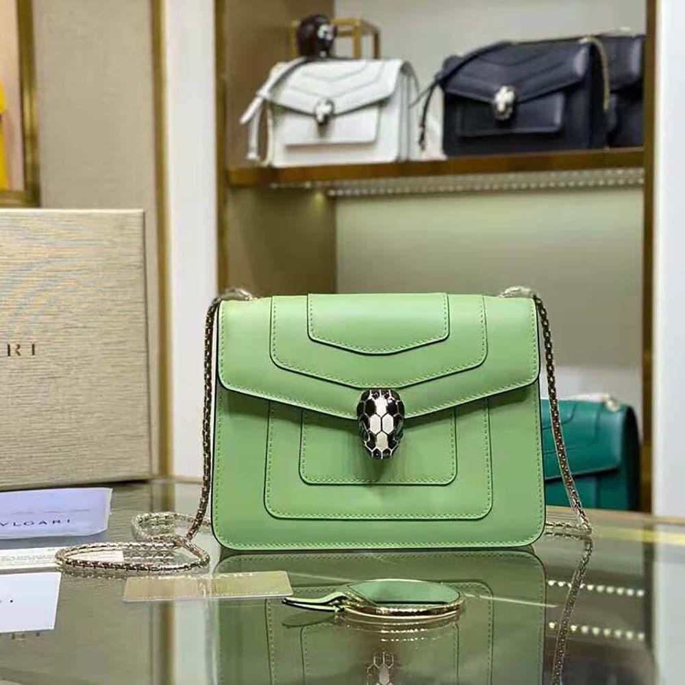 Close-up of gold-tone serpent head clasp on Bvlgari Women Serpenti Forever Crossbody Bag-Green