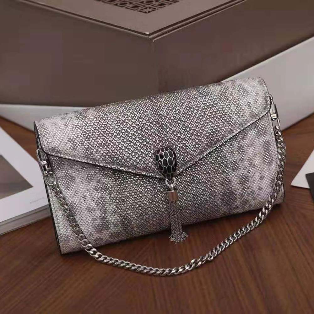 Close-up of gold-tone serpent head clasp on Bvlgari Women Serpenti Forever Pochette