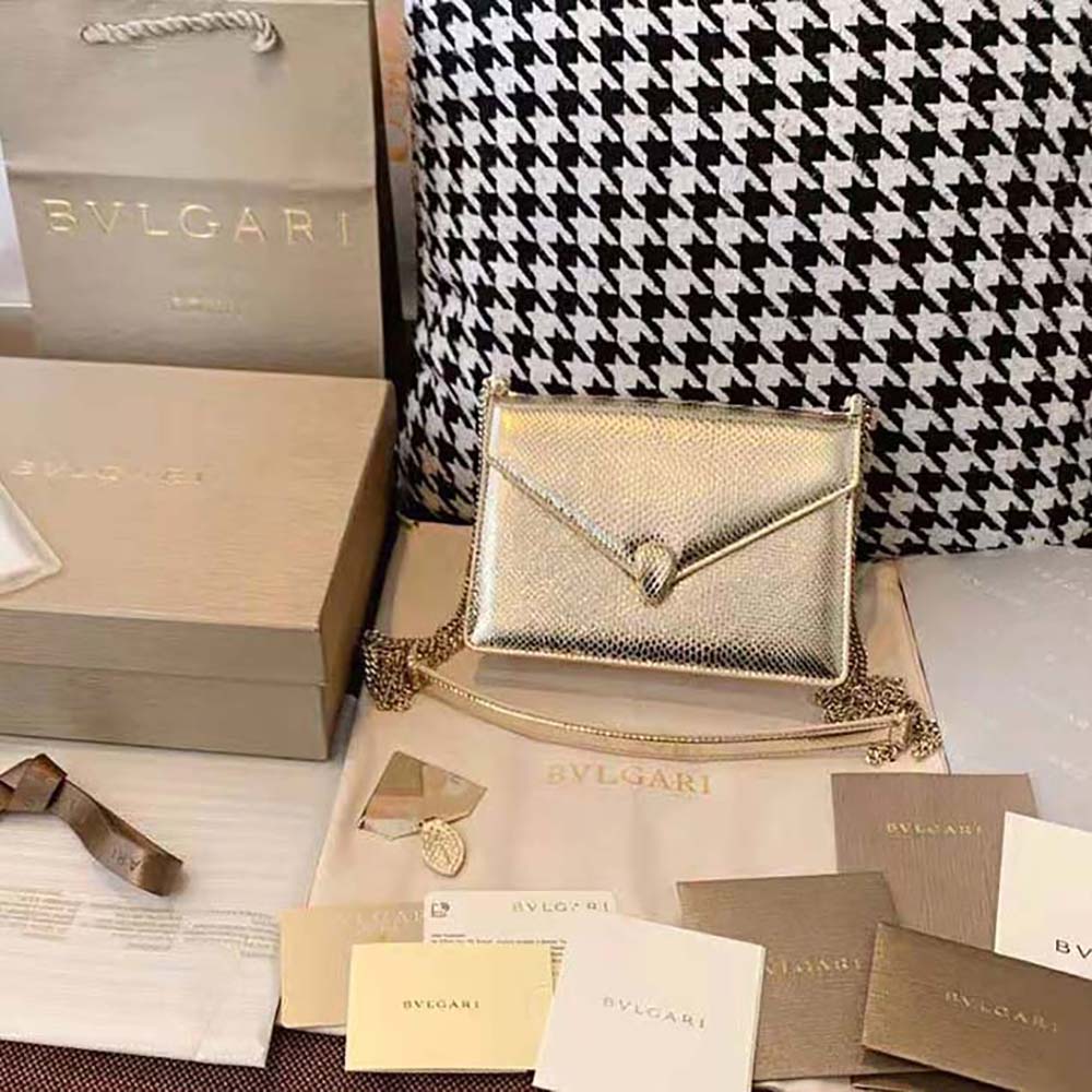 Close-up of signature Serpenti snakehead closure on Bvlgari Serpenti Forever Shoulder Bag