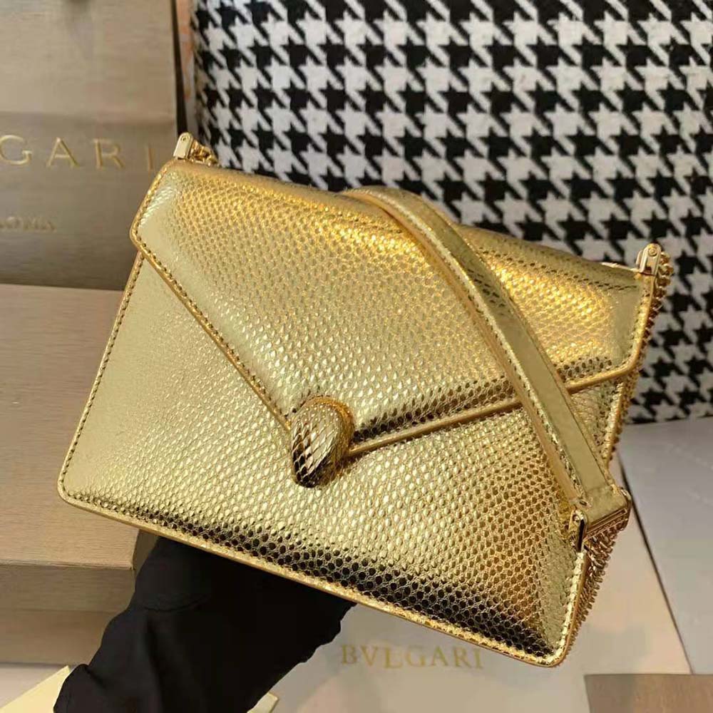 Close-up of gold serpent head clasp on Bvlgari Women Serpenti Forever Shoulder Bag
