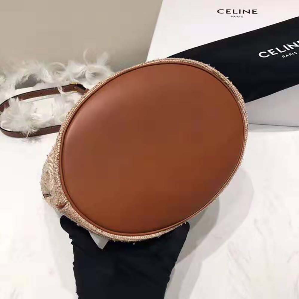 Side angle showcasing soft bucket silhouette of Celine Women Small Soft Bucket Bag