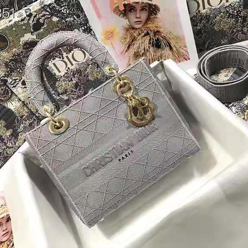 Close-up of silver hardware and Cannage embroidery detail on Dior bag