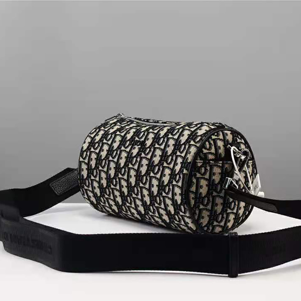 Side angle showing slim silhouette of Dior Men Beige and Black Dior Oblique Jacquard Roller Messenger Bag