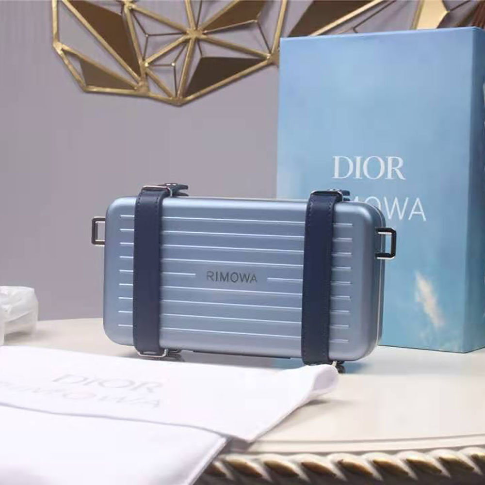 Side angle showing aluminum frame and grained calfskin clutch detail