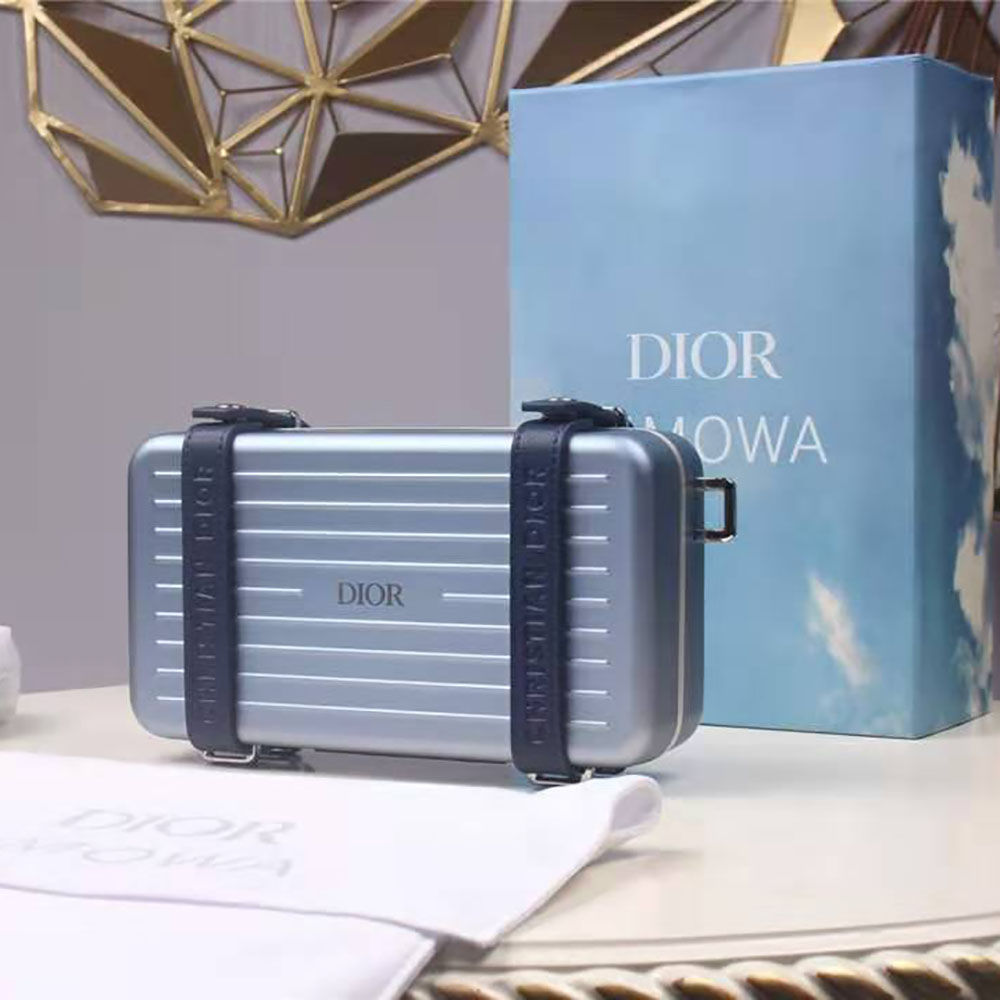 Zipper and brushed metal hardware on Dior Men Dior and Rimowa clutch