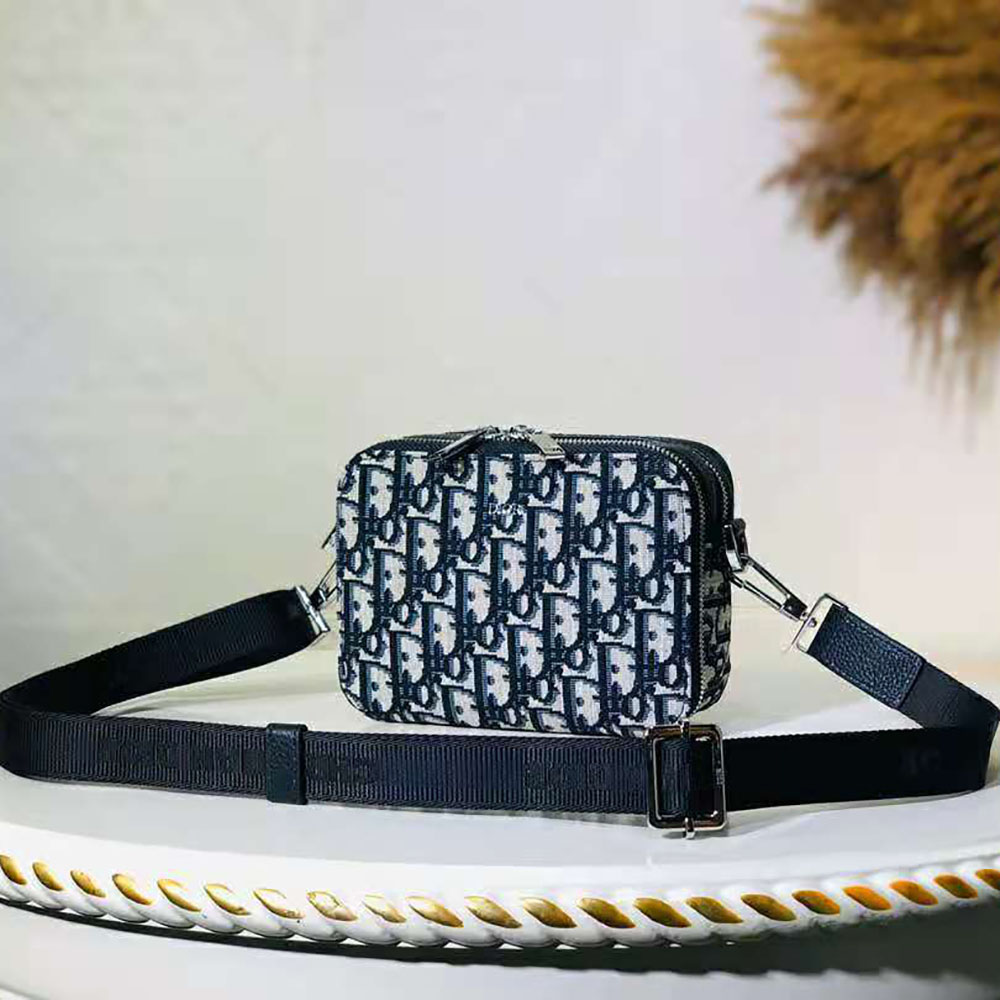 Close-up of silver-tone hardware on Dior Men Pouch with Shoulder Strap