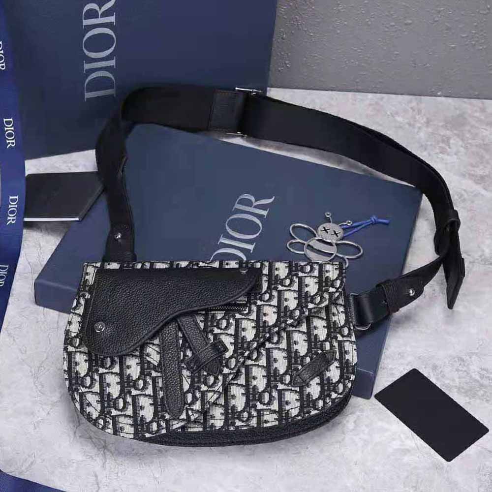 Close-up detail of silver-tone hardware on Dior Men Saddle Pouch