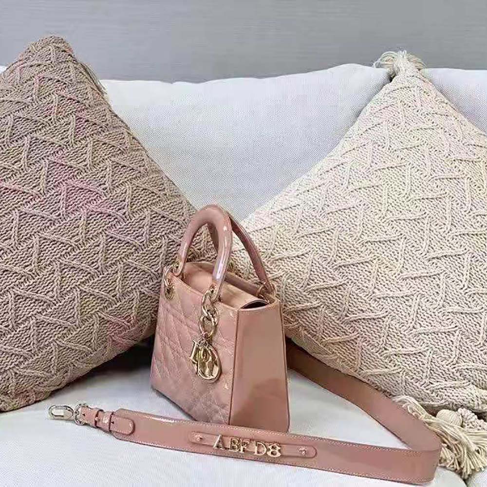 Side angle showing signature cannage quilting of Dior Small Lady Dior Bag Patent Calfskin