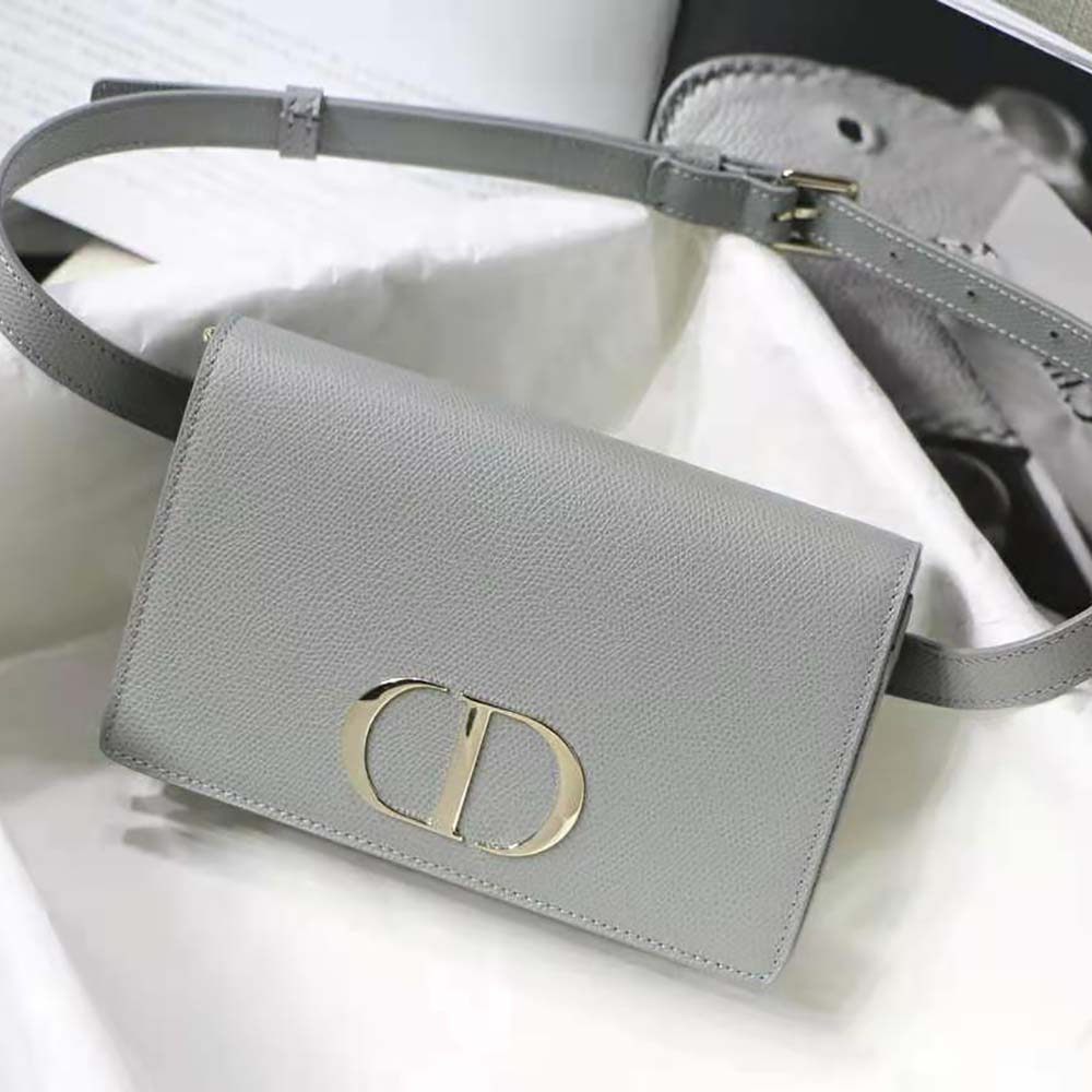Close-up on silver hardware and grained leather texture of Dior pouch