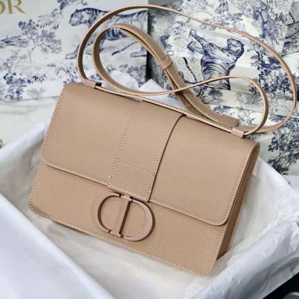 Close-up of silver Dior hardware on the pink Montaigne shoulder bag