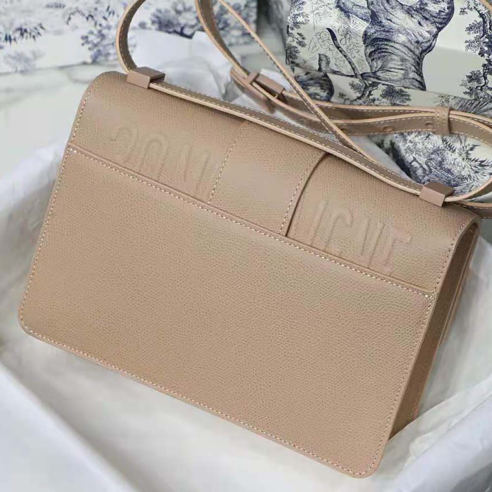 Side profile showing silhouette and strap details of Dior Women 30 Montaigne Bag