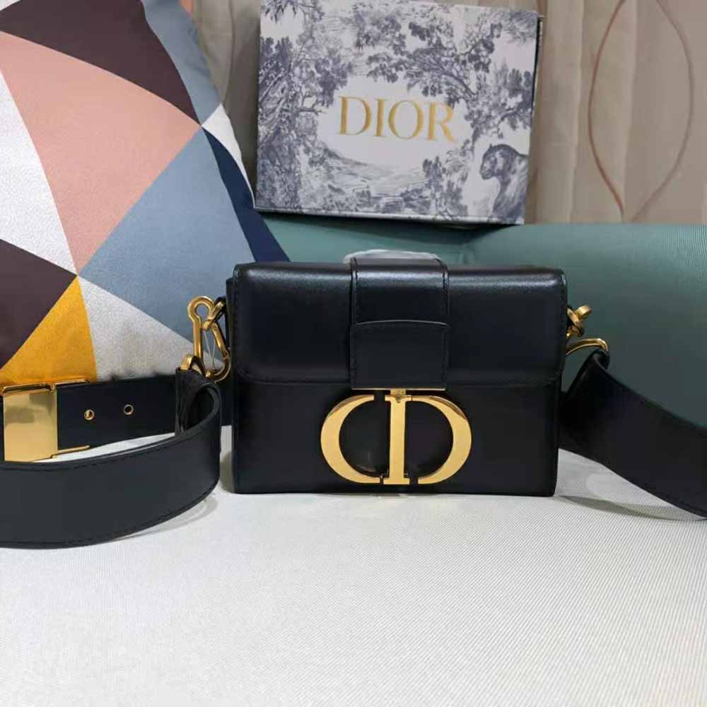 Close-up of black box calfskin texture and Dior signature hardware detail